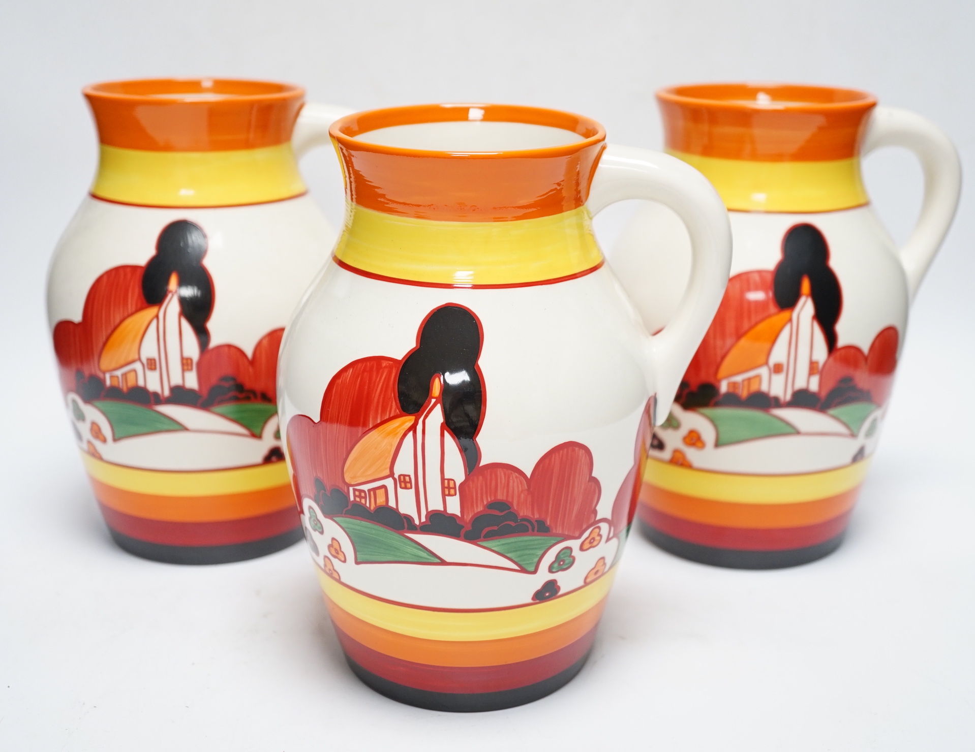 Three Wedgwood Bizarre Clarice Cliff Lotus jugs - Farmhouse pattern, limited edition with boxes and certificates, jugs 20cm high